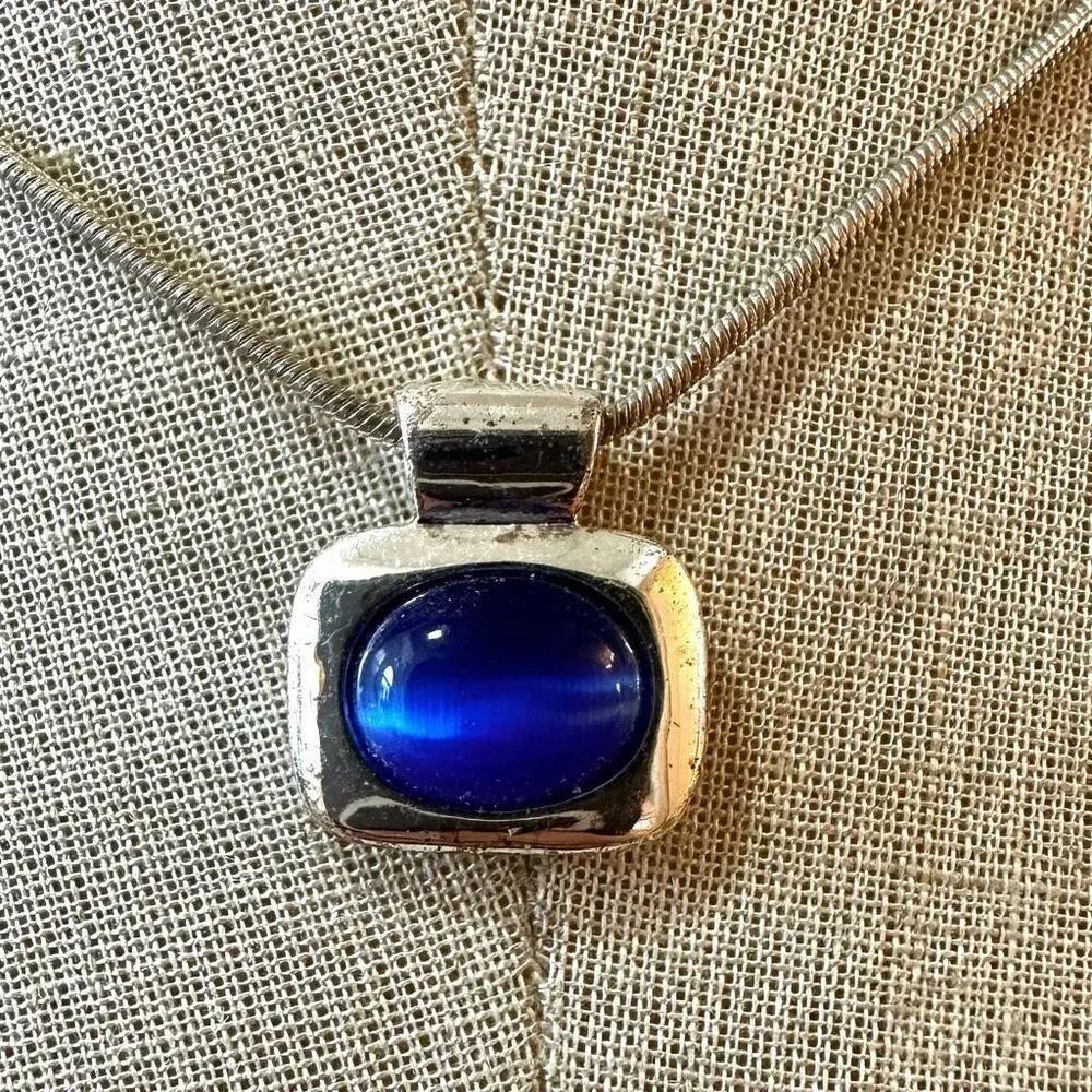 Silver tone and blue pendant necklace